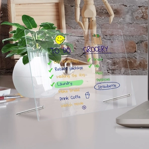 Macro shot of acrylic memo board with metal stand and colorful handwritten to-do list