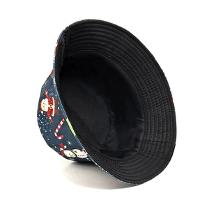 Navy blue Christmas bucket hat with Santa and snowman prints, reversible black lining