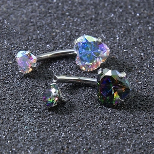 Macro shot of heart-shaped iridescent zirconia on stainless steel curved belly rings