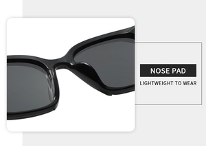 Macro view of classic black sunglasses featuring a reinforced integrated nose pad design