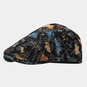 Detailed view of black jacquard beret hat featuring colorful butterfly patterns
