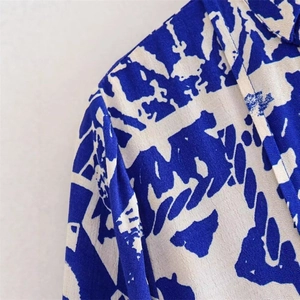Women's slim fit shirt featuring unique blue and white abstract geometric print texture