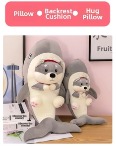 Detail showing two sizes of shark husky plush toys with embroidery and soft paw pads