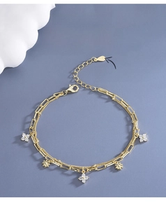 Macro shot of S925 sterling silver gold-plated clover bracelet with zircon inlay detail