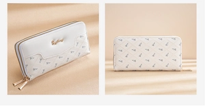 Close-up of long white PU leather wallet featuring quilted floral patterns and gold zippers