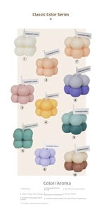 Close-up of handmade bubble cube candles in 10 colors including rose and vanilla scents