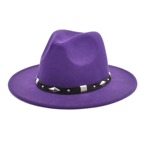 Detail of purple wool felt jazz hat featuring black leather band and silver metal rivets
