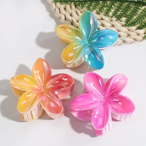 Three gradient laser lily flower hair claws in pink, orange, and blue-green colors