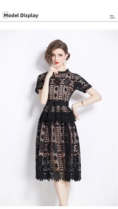 Detail of elegant black hollow lace midi dress showing intricate floral embroidery patterns
