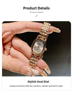 Detail of rose gold mesh strap watch with sunray brushed oval dial and stick markers