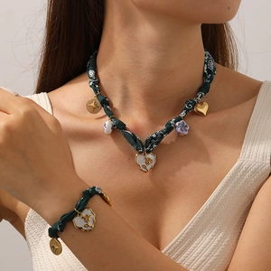 Bohemian heart necklace and bracelet set with green patterned fabric and gold charms
