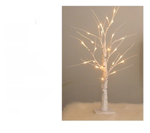 Close-up of birch tree LED light showing realistic bark texture and warm glowing bulbs