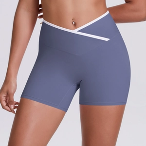 Close-up of crossover high waist yoga shorts with white contrast trim in grey-purple