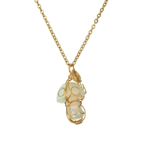 Detailed view of handmade gold wire-wrapped iridescent green crystal mushroom pendant