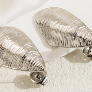 Minimalist silver stainless steel textured teardrop earrings with vertical stripe pattern
