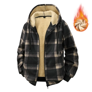 Close-up of thick fleece lining and plaid pattern on winter hooded jacket