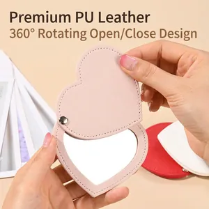 Pink heart-shaped PU leather portable makeup mirror with 360-degree rotating design