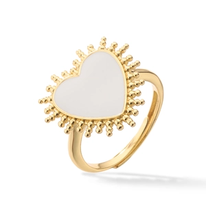Detail of golden adjustable sunburst ring with white heart inlay and beaded edges