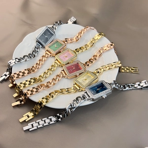 Detailed display of colorful square quartz watches with diamond accents and metal chains