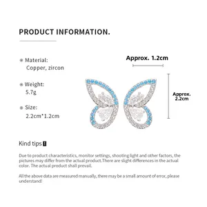 Detail view of butterfly earrings with blue zircons, size 2.2cm by 1.2cm and 5.7g weight
