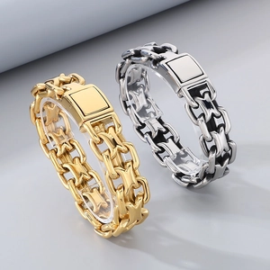Detailed view of silver and gold chain bracelets on display with rectangular clasps