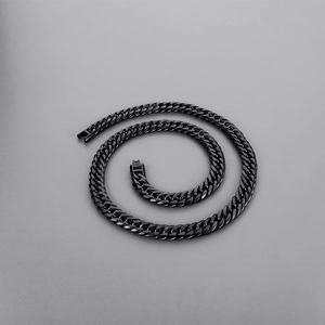 Close-up of black stainless steel Cuban link chain necklace with polished metallic finish