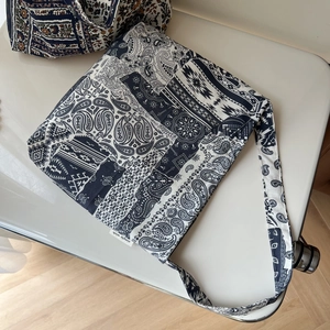 Detail of bohemian patchwork shoulder bag with paisley patterns and tribal elements