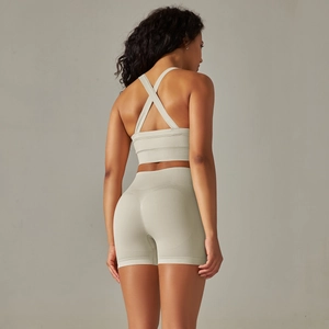 Detail of cross back straps and seamless ribbed fabric on the sports bra and shorts