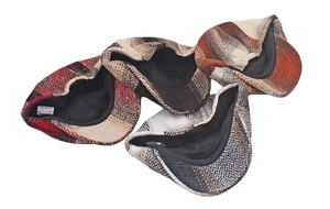 Detail of assorted wool-like herringbone newsboy caps showing polyester lining texture