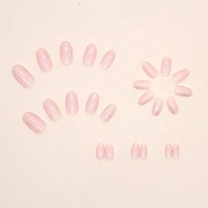 Pink gradient press-on nails with silver glitter sparkles and elegant oval shape