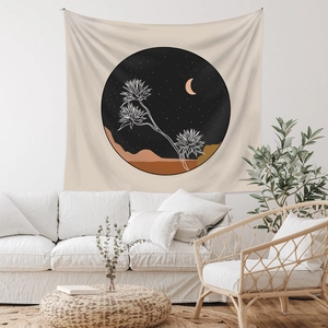 Detail of bohemian wall tapestry featuring desert night stars and cactus art in a cozy room