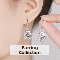 Close-up of silver-plated drop earrings with round brilliant stone on a model ear