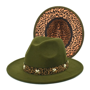 Detail of dark green wool fedora with leopard print band and golden star studs
