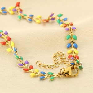 Golden titanium steel anklet featuring colorful enamel leaf charms and lobster clasp