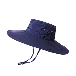 Detail of navy blue outdoor sun hat showing breathable metal eyelets and adjustable chin strap