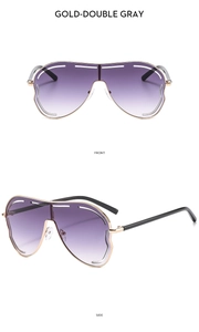 Vue détaillée de face et de profil de lunettes oversize dorées aux verres violets dégradés