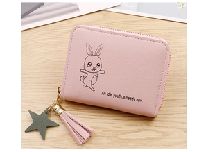 Detailed macro of pink PU leather coin purse featuring rabbit print and star pendant