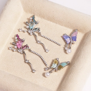 Set of asymmetric silver butterfly pendants with multicolored zircons and tiny pearls