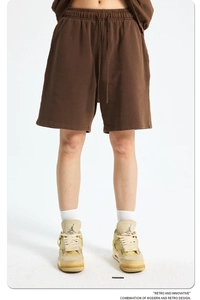 Detail of brown washed cotton sweat shorts with adjustable drawstring and elastic waist