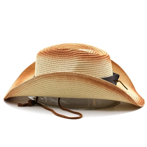 Detail view of gradient straw cowboy hat with rivet leather belt and windproof rope