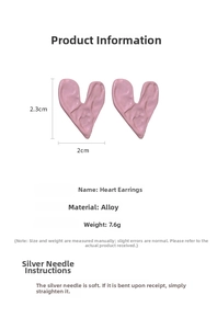 Detail view of pink pleated heart earrings showing size 2.3cm x 2cm and silver needle