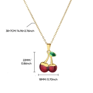 Sweet cherry pendant necklace with red fruit and green leaves on a gold chain