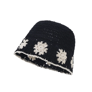 Black crochet bucket hat with hollow flower patterns for a stylish vintage summer look