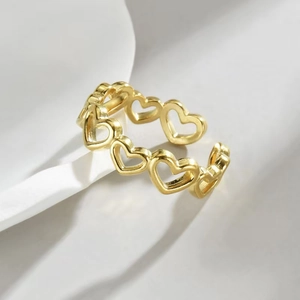 Minimalist golden stainless steel open ring with hollow heart chain design for women