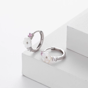 Macro detail of S925 silver flower earrings with pink and clear zircon stones