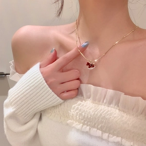 Gold plated pearl necklace with red rocking horse pendant and crystal accents for women