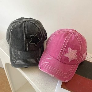 Vintage distressed baseball caps in charcoal grey and rose pink with star patch detail