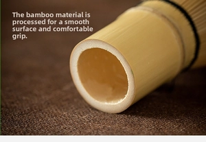 Macro shot of smooth natural bamboo handle and detailed craftsmanship of a matcha whisk