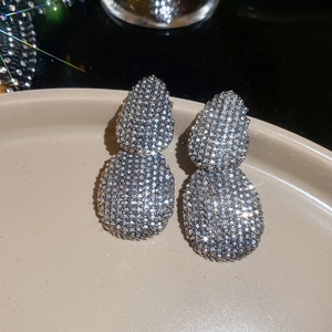 Macro shot of silver-tone double oval drop earrings with shimmering micro-pave crystals