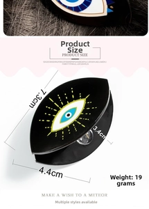 Detail view of the black Evil Eye hair claw clip showing precise 7.3cm size measurements